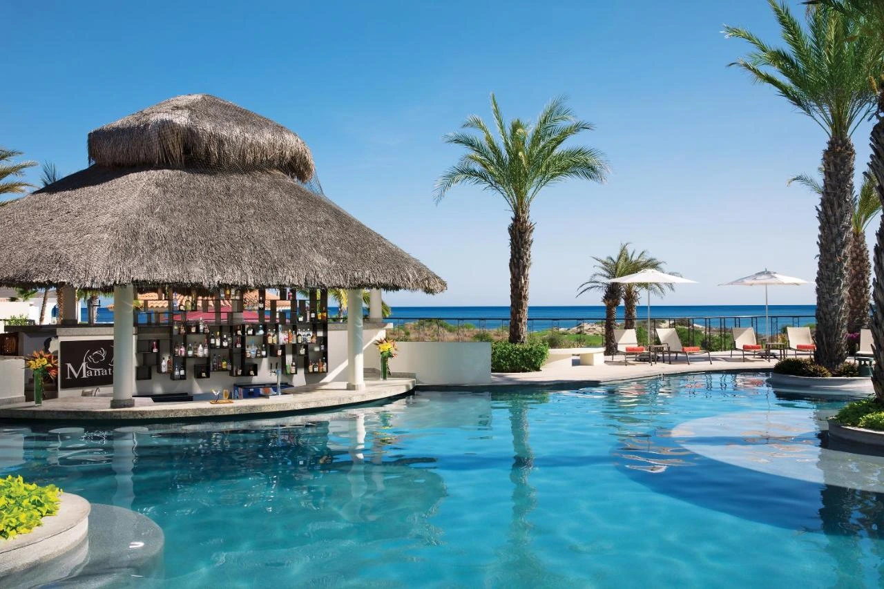 Swimming pool with bar at Secrets Puerto Los Cabos Golf & Spa Resort All Inclusive